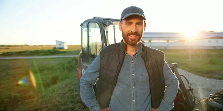 farmer in front of tractor